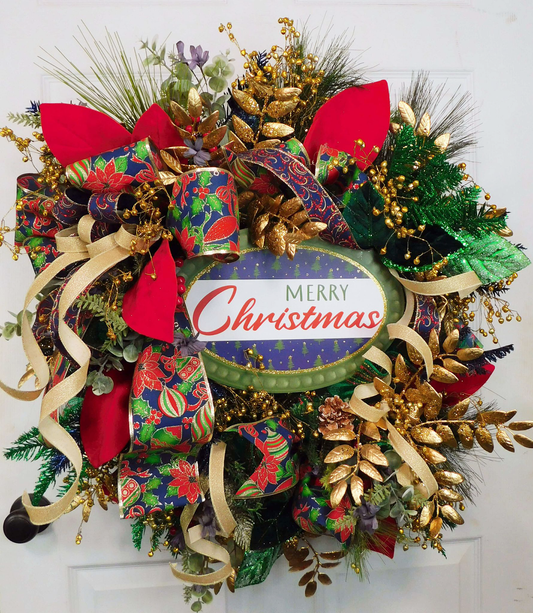 Festive Christmas Wreath with Gold Accents, Red and Green Poinsettia Ribbon, Glittery Ornaments, and 'Merry Christmas' Sign – Elegant Holiday Door Decor